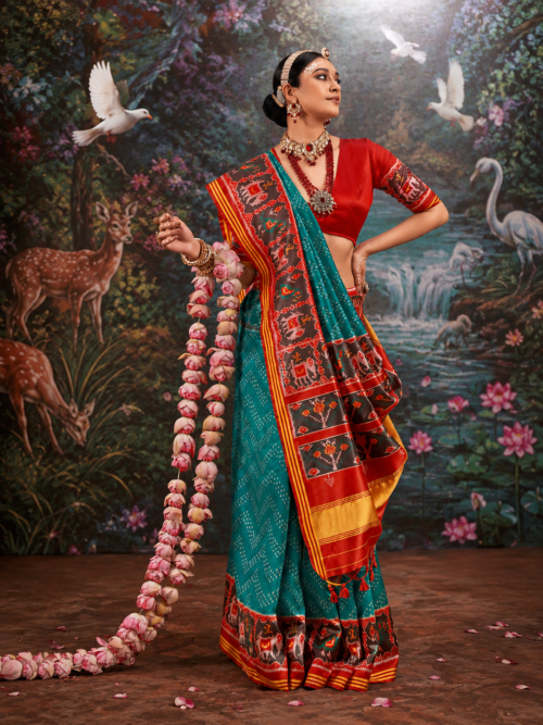 Teal Blue & Crimson Red Patola Silk Saree with Intricate Ikat Motifs Teal Blue & Crimson Red Patola Silk Saree with Intricate Ikat Motifs